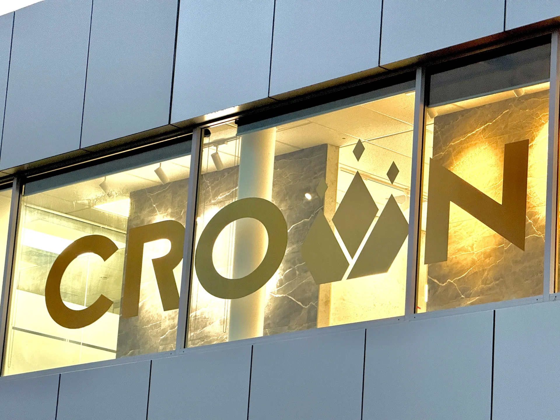 The gold Crown sign in the Rosedale showroom window